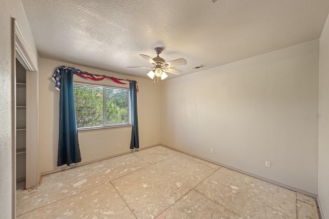 172 Candy Rd, Pipe Creek, TX 78063 - spare room featuring a textured ceiling and ceiling fan