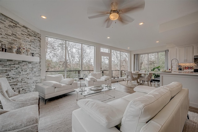 6628 Bayou Glen Rd Unit 6628, Houston, TX 77057 - living room featuring healthy amount of natural light, a ceiling fan, recessed lighting, and light wood-type flooring