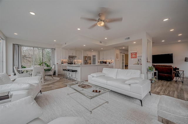 6628 Bayou Glen Rd Unit 6628, Houston, TX 77057 - living room with light wood-type flooring, ceiling fan, and recessed lighting