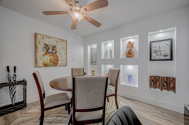 6628 Bayou Glen Rd Unit 6628, Houston, TX 77057 - dining area with light wood-style floors, ceiling fan, and baseboard heating
