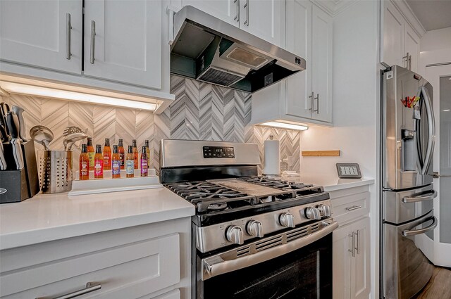 6628 Bayou Glen Rd Unit 6628, Houston, TX 77057 - kitchen with stainless steel appliances, extractor fan, light countertops, backsplash, and white cabinetry