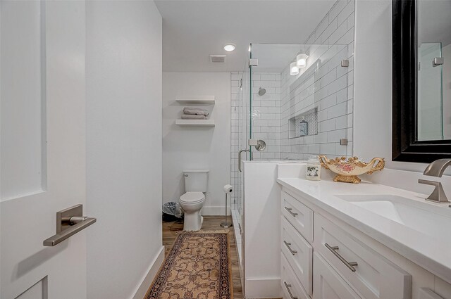 6628 Bayou Glen Rd Unit 6628, Houston, TX 77057 - bathroom featuring vanity, a stall shower, and wood finished floors