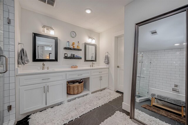 6628 Bayou Glen Rd Unit 6628, Houston, TX 77057 - full bathroom with a stall shower, double vanity, recessed lighting, and tile patterned floors