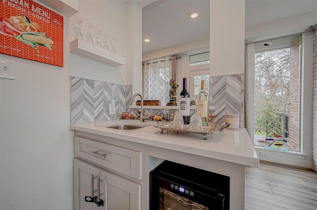 6628 Bayou Glen Rd Unit 6628, Houston, TX 77057 - kitchen featuring plenty of natural light, light countertops, white cabinetry, tasteful backsplash, and recessed lighting