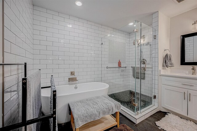 6628 Bayou Glen Rd Unit 6628, Houston, TX 77057 - full bath featuring tile walls, vanity, a stall shower, a soaking tub, and recessed lighting