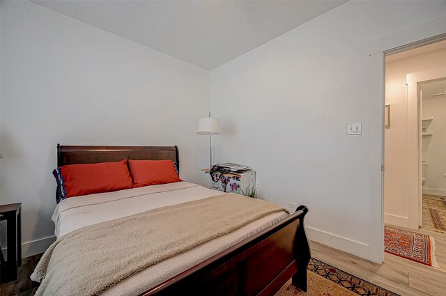 6628 Bayou Glen Rd Unit 6628, Houston, TX 77057 - bedroom with light wood-style floors and baseboards