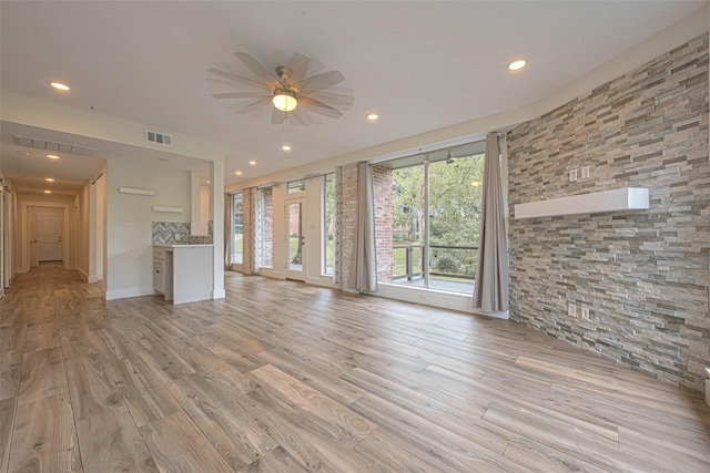 6628 Bayou Glen Rd Unit 6628, Houston, TX 77057 - unfurnished living room featuring ceiling fan, recessed lighting, and light wood-style floors