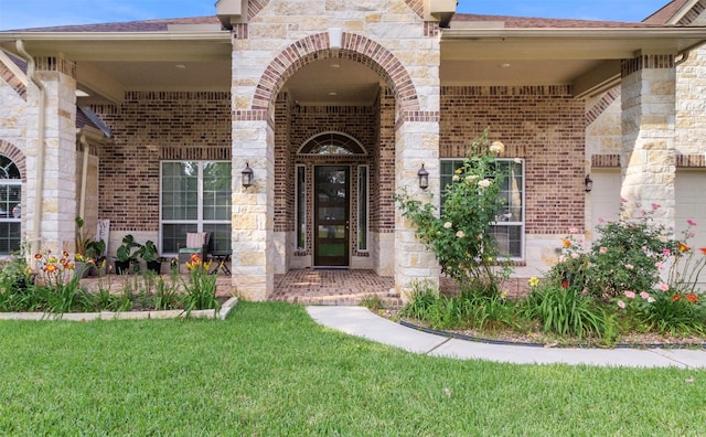 13336 Lake Breeze Ln, Willis, TX 77318 - doorway to property with brick siding, a lawn, roof with shingles, and stone siding