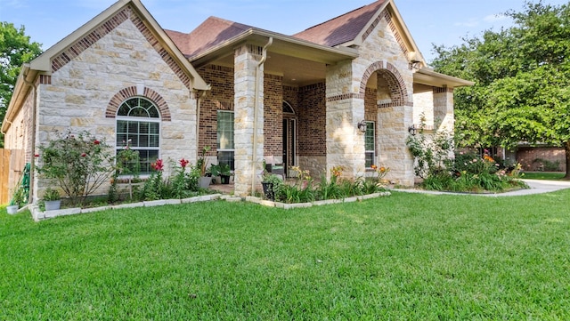 13336 Lake Breeze Ln, Willis, TX 77318 - view of front facade with stone siding and roof with shingles