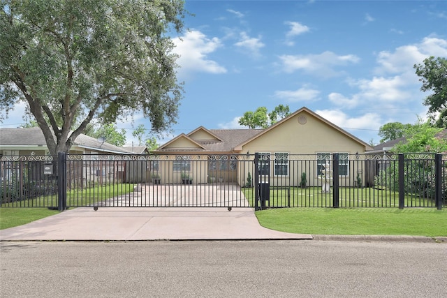 5227 Falvey St, Houston, TX 77017 - view of front facade featuring a fenced front yard, a gate, and stucco siding