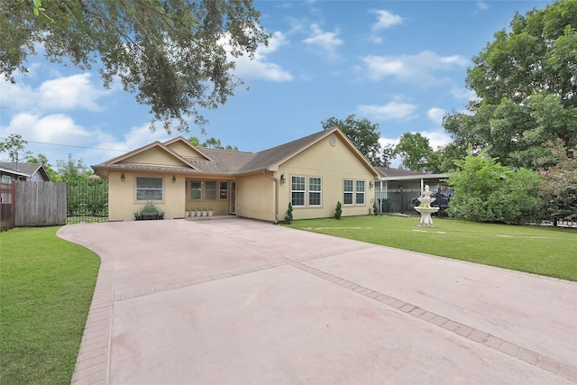 5227 Falvey St, Houston, TX 77017 - ranch-style home with driveway, stucco siding, and a patio area
