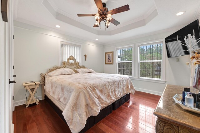5227 Falvey St, Houston, TX 77017 - bedroom with dark wood finished floors, a tray ceiling, ornamental molding, a ceiling fan, and recessed lighting