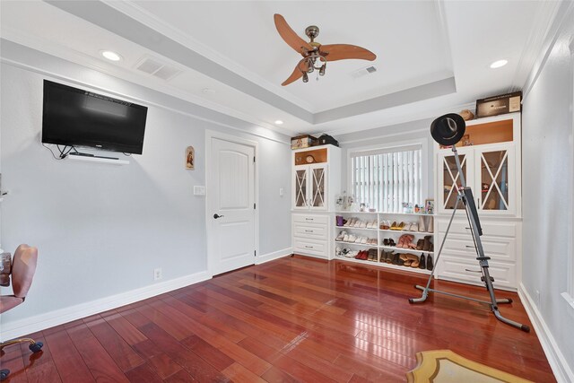 5227 Falvey St, Houston, TX 77017 - exercise room with a tray ceiling, a ceiling fan, wood-type flooring, recessed lighting, and crown molding