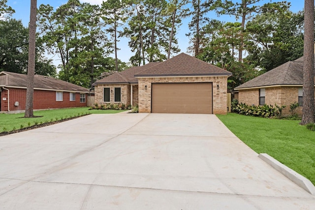 327 Paradise Ln, Montgomery, TX 77356 - ranch-style home featuring driveway, a front yard, and brick siding