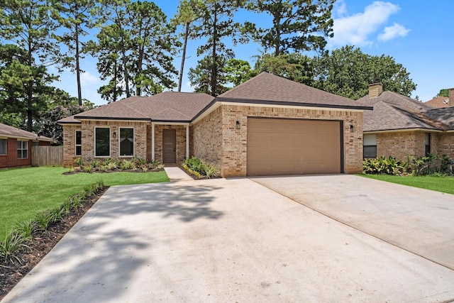 327 Paradise Ln, Montgomery, TX 77356 - view of front of home featuring brick siding, an attached garage, driveway, and a shingled roof
