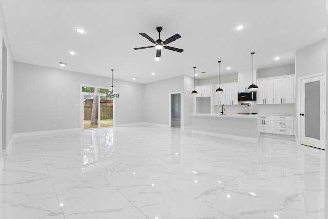 327 Paradise Ln, Montgomery, TX 77356 - unfurnished living room featuring recessed lighting, light marble finish flooring, and ceiling fan