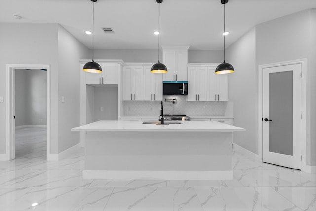 327 Paradise Ln, Montgomery, TX 77356 - kitchen featuring stainless steel microwave, white cabinetry, light countertops, decorative backsplash, and recessed lighting