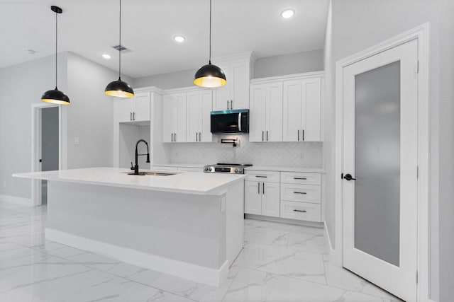 327 Paradise Ln, Montgomery, TX 77356 - kitchen featuring stainless steel microwave, light marble finish flooring, recessed lighting, white cabinets, and tasteful backsplash