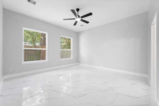 327 Paradise Ln, Montgomery, TX 77356 - empty room featuring marble finish floors and ceiling fan
