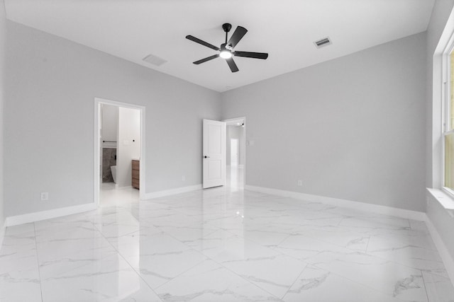 327 Paradise Ln, Montgomery, TX 77356 - empty room with light marble finish floors and a ceiling fan