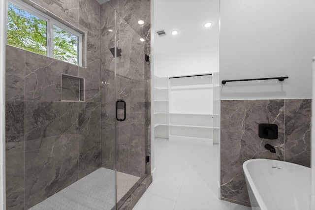 327 Paradise Ln, Montgomery, TX 77356 - bathroom with a soaking tub, a stall shower, tile walls, and recessed lighting