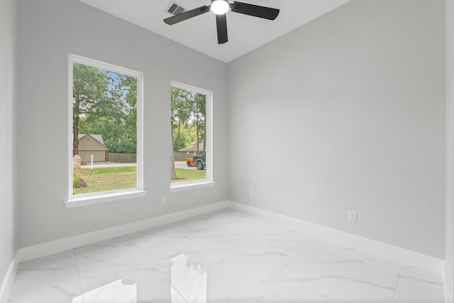 327 Paradise Ln, Montgomery, TX 77356 - spare room featuring marble look tiles and a ceiling fan