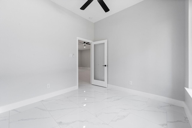 327 Paradise Ln, Montgomery, TX 77356 - unfurnished room with marble finish flooring, a ceiling fan, and a towering ceiling