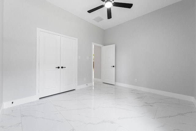 327 Paradise Ln, Montgomery, TX 77356 - unfurnished bedroom featuring marble finish flooring, a closet, and a ceiling fan