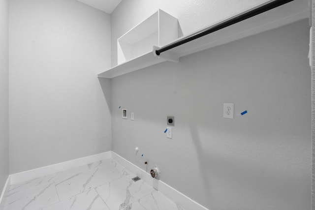 327 Paradise Ln, Montgomery, TX 77356 - laundry room featuring gas dryer hookup, electric dryer hookup, washer hookup, and marble look tile flooring