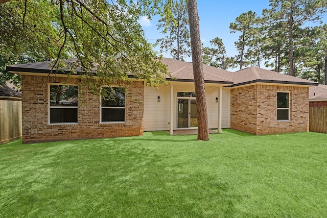 327 Paradise Ln, Montgomery, TX 77356 - back of house featuring brick siding and roof with shingles