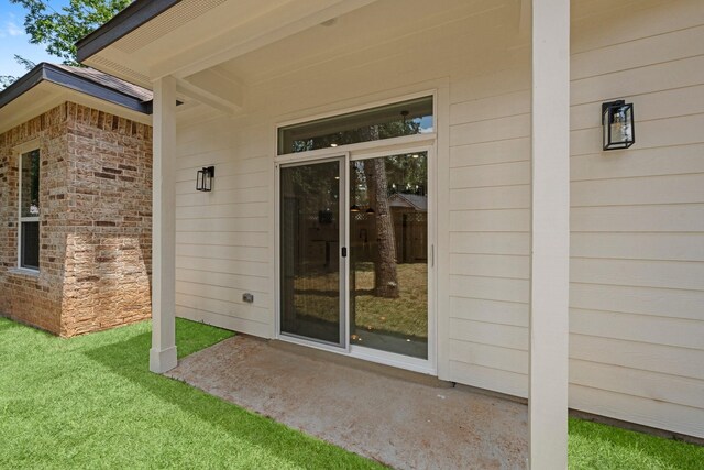 327 Paradise Ln, Montgomery, TX 77356 - property entrance with a lawn