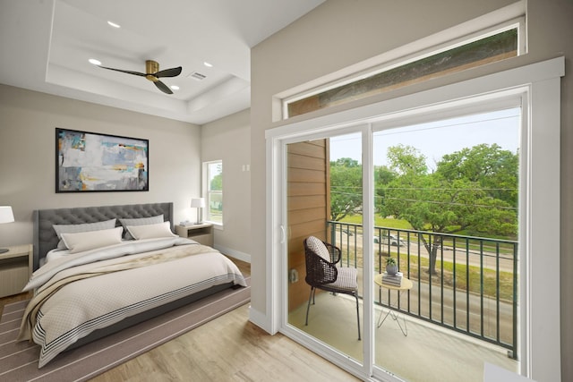 357 Cavalcade St, Houston, TX 77009 - bedroom featuring access to outside, light wood-type flooring, recessed lighting, and a raised ceiling