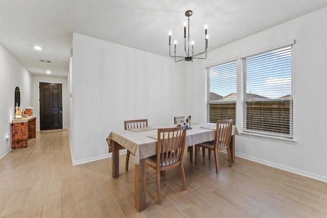 7003 Tehama Ln, Rosharon, TX 77583 - dining space with a chandelier, light wood-style flooring, and recessed lighting