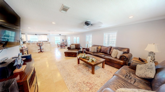 110 Four Master Rd, Freeport, TX 77541 - living room with a ceiling fan, recessed lighting, ornamental molding, and a textured ceiling