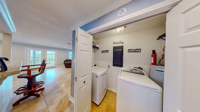 110 Four Master Rd, Freeport, TX 77541 - laundry room with electric panel, washing machine and clothes dryer, light tile patterned floors, and a textured ceiling