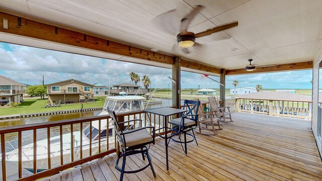 110 Four Master Rd, Freeport, TX 77541 - deck with a ceiling fan, a water view, boat lift, and a residential view