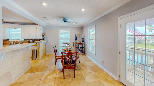 110 Four Master Rd, Freeport, TX 77541 - dining space featuring healthy amount of natural light, ornamental molding, a ceiling fan, recessed lighting, and a textured ceiling