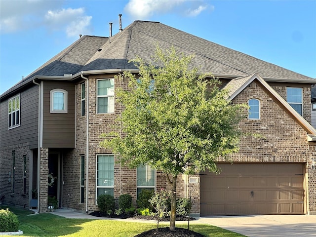 18718 Fairmont Springs Ct, Cypress, TX 77429 - view of front of home with brick siding, driveway, roof with shingles, and a garage