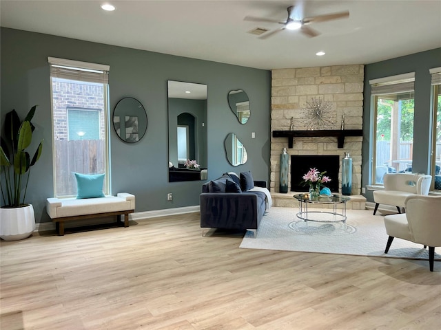 18718 Fairmont Springs Ct, Cypress, TX 77429 - living room with a ceiling fan, wood finished floors, a fireplace, and recessed lighting