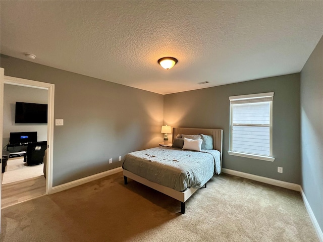 18718 Fairmont Springs Ct, Cypress, TX 77429 - bedroom featuring carpet and a textured ceiling