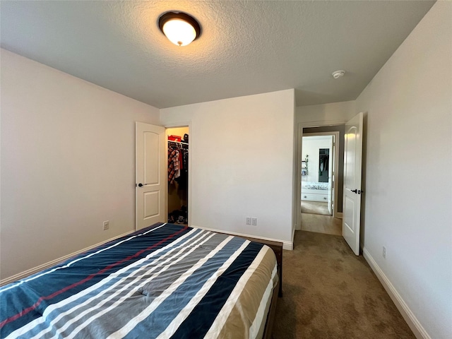 18718 Fairmont Springs Ct, Cypress, TX 77429 - unfurnished bedroom with carpet flooring, a textured ceiling, and a closet