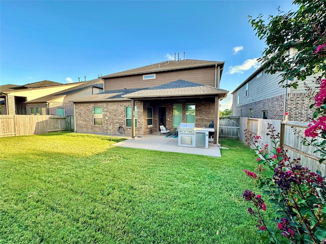 18718 Fairmont Springs Ct, Cypress, TX 77429 - rear view of house featuring a patio area, a fenced backyard, brick siding, and a shingled roof