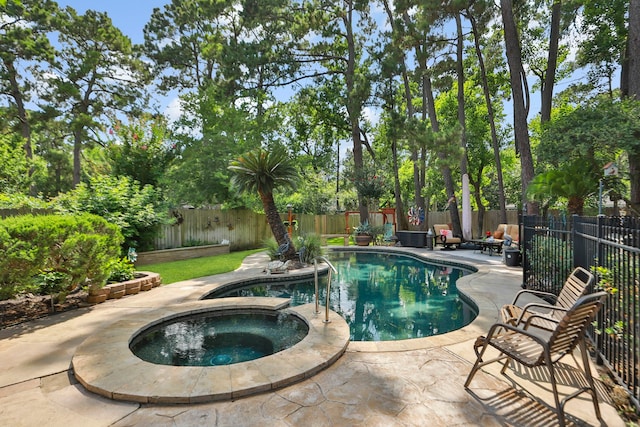 6430 Willow Pine Dr, Spring, TX 77379 - view of swimming pool featuring a fenced backyard, a patio area, and a pool with connected hot tub