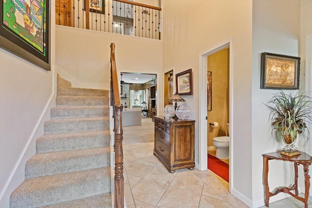 6430 Willow Pine Dr, Spring, TX 77379 - staircase with a high ceiling and tile patterned flooring