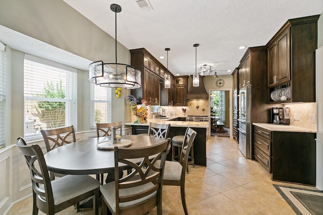 6430 Willow Pine Dr, Spring, TX 77379 - dining room featuring a chandelier, light tile patterned floors, recessed lighting, a textured ceiling, and wainscoting