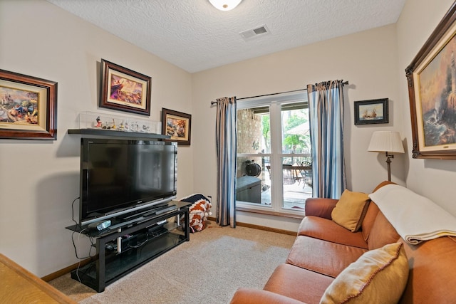 6430 Willow Pine Dr, Spring, TX 77379 - carpeted living room featuring a textured ceiling and baseboards