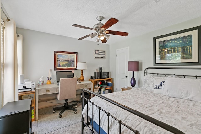 6430 Willow Pine Dr, Spring, TX 77379 - bedroom with carpet flooring, a desk, a textured ceiling, and a ceiling fan