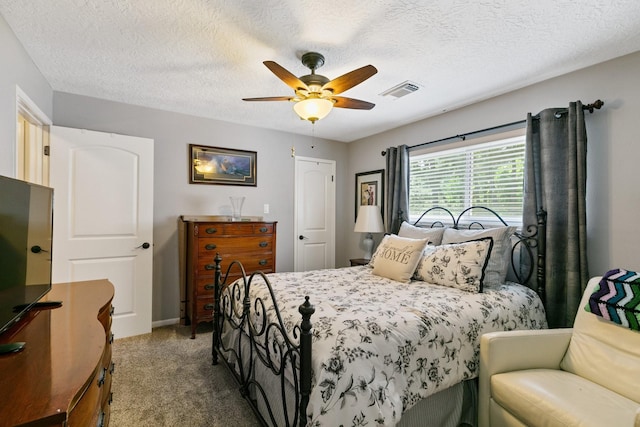 6430 Willow Pine Dr, Spring, TX 77379 - bedroom with carpet flooring, ceiling fan, and a textured ceiling
