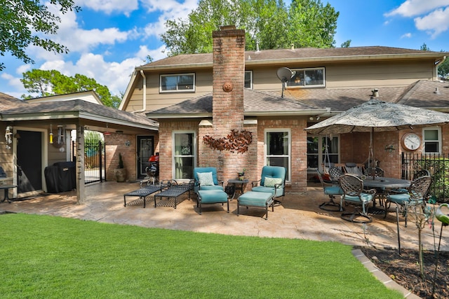 6430 Willow Pine Dr, Spring, TX 77379 - back of property with a patio area, a chimney, a shingled roof, and brick siding