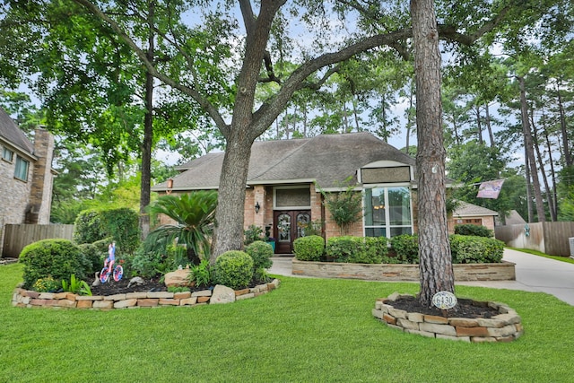 6430 Willow Pine Dr, Spring, TX 77379 - view of front of property featuring roof with shingles, french doors, and brick siding